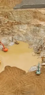 Aerial shot of construction site with excavators in a brown earth setting.