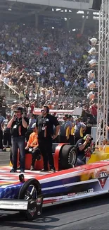 Drag racing car on track with crowd