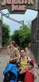 Family enjoying Jurassic Park theme park adventure.