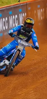 Motorcycle rider racing on a dirt track.
