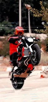 Motorcycle performing a thrilling front wheelie stunt, featuring vibrant red accents.