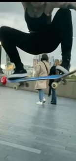 Skateboarder performing a jump on city walkway.