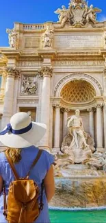 Woman admiring Trevi Fountain in Rome, iconic travel destination.