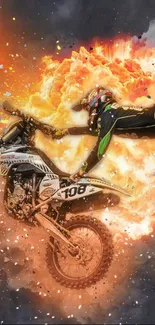 Motocross rider performing a daring stunt in front of a fiery explosion.