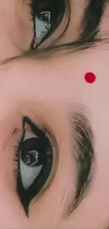 Close-up of eyes with expressive look and red bindi.