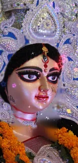 Goddess Durga artwork with blue and silver adornments.