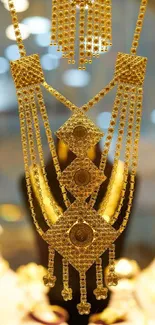 Luxurious gold jewelry necklace with intricate design.