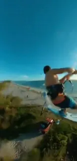 Kiteboarding action over stunning beach landscape.