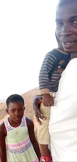 Family enjoying a sunny day outdoors, father with children.