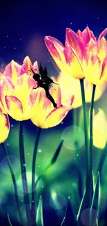 Fairy sitting on glowing yellow tulips at night.