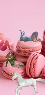 Pink fantasy wallpaper with unicorn, fairies, and macarons.