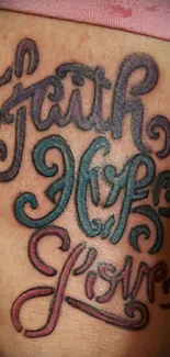 Faith Hope Love tattoo design with colorful typography.