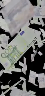 Falling euro banknotes on black background wallpaper.