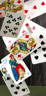 Falling playing cards mobile wallpaper in vibrant colors.