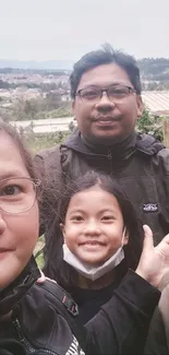 Family enjoying a day in nature with scenic landscape.