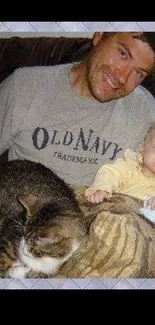 Father, baby, and cat in cozy home setting.