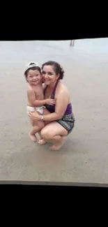 Mother and child enjoying a beach day, captured in a heartwarming moment.