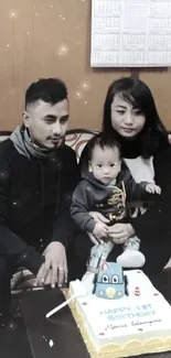 Family celebrating first birthday with cake.