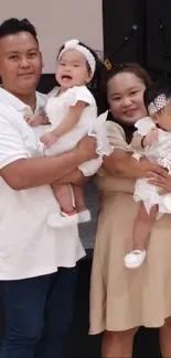 Family in elegant attire celebrating together.