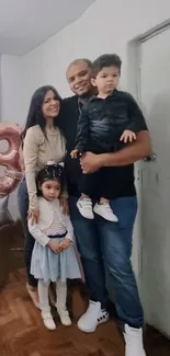 Family portrait with balloon decoration and warm tones.