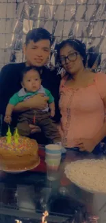 Family celebrating with cake and decorations.