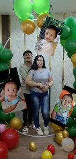 Family celebrating with balloons and baby photos, creating a festive atmosphere.