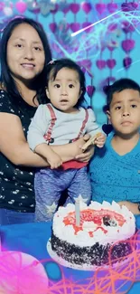 Family celebrating with birthday cake in vibrant blue setting.