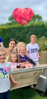 Family enjoying an outdoor outing with kids in a rustic setting under a heart icon.