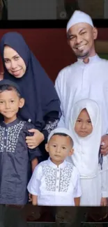 Heartwarming family portrait with smiling faces in cultural attire.