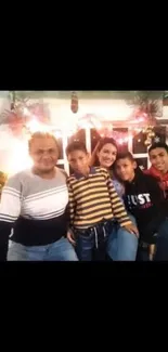 Family enjoying holiday celebration with festive lights and smiles.