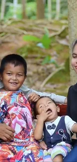 Family enjoying time outdoors amidst lush green forest backdrop.