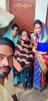 Family wearing traditional clothing with vibrant colors.