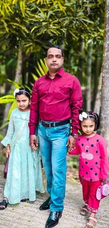 Father and daughters in nature with vibrant colors.