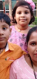 Family enjoying outdoor gathering with greenery.