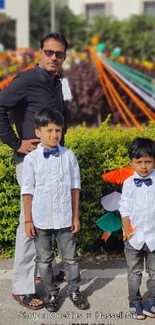 Family portrait outdoors with colorful decorations.