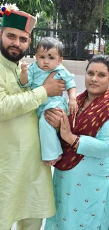 Family in traditional attire with a serene green backdrop.