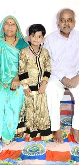 Family portrait with vibrant traditional attire and colorful background.