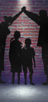 Family silhouette beneath spotlight on brick wall background.