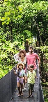 A family walking on a bridge in a lush green forest.