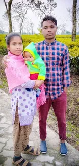 Family in tea garden with vibrant colors.