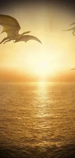 Fantasy wallpaper of dragons flying at sunset over a golden ocean.