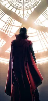 Silhouette of a fantasy hero with a red cloak in architectural setting.