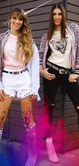 Fashionable duo with colorful splash effect on a mobile wallpaper.