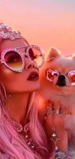 Woman with pink hair and dog wearing heart sunglasses at sunset.