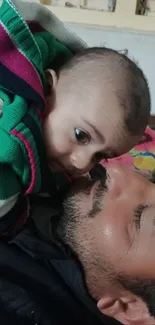 Father with his baby, close and loving moment displayed.