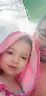 Father and child enjoy a sunny day at the beach.