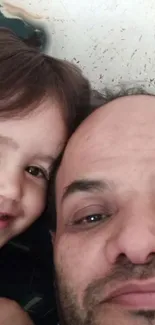 Father and child smiling close-up photo.