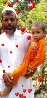 Father holding child in a lush green setting.