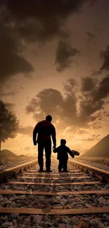 Father and child walking on railway tracks at sunset.
