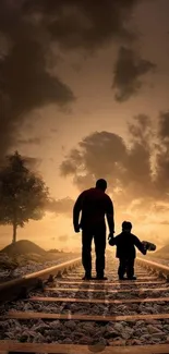 Father and child walk on railway tracks at sunset, silhouetted against the sky.